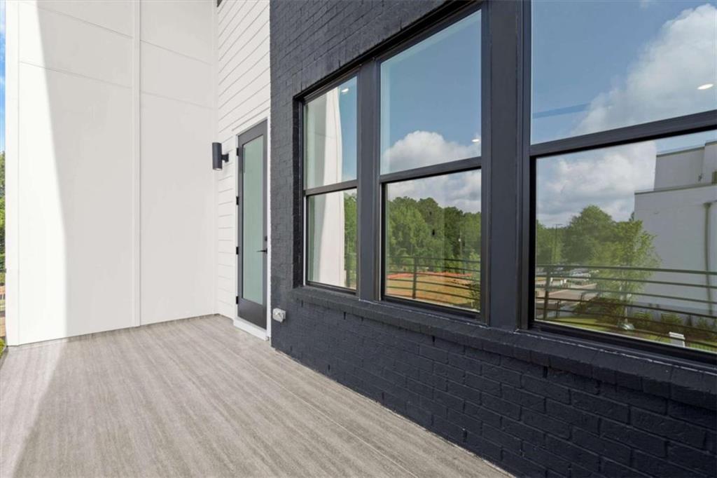 326 Treble Way Alpharetta, GA 30009 - Photo 31 of 47 a view of an empty room with wooden floor and a window