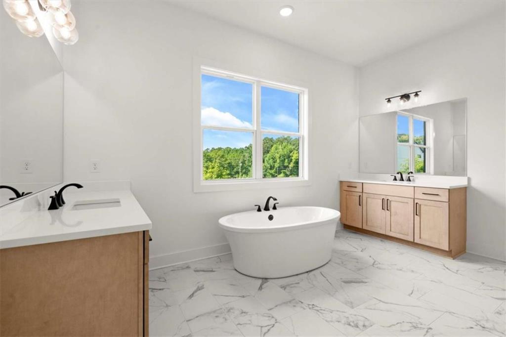 326 Treble Way Alpharetta, GA 30009 - Photo 32 of 47 a bathroom with a sink and a bathtub