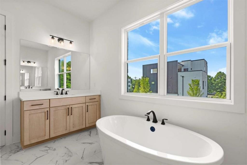 326 Treble Way Alpharetta, GA 30009 - Photo 33 of 47 a bathroom with a bathtub and a sink