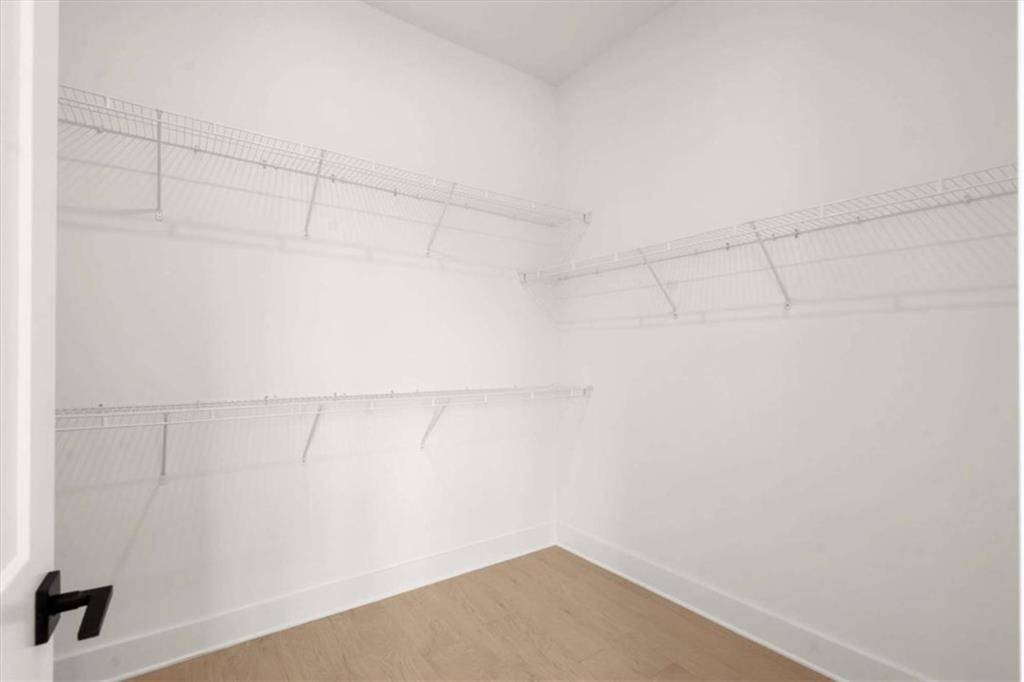 326 Treble Way Alpharetta, GA 30009 - Photo 35 of 47 a view of a room with racks on the wall