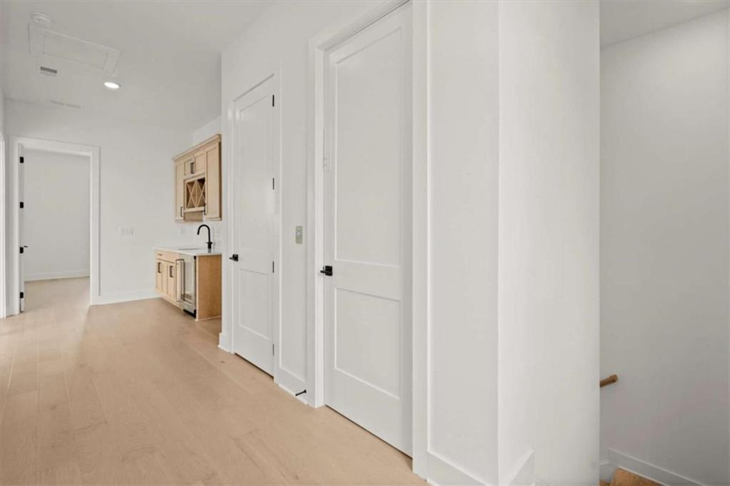 326 Treble Way Alpharetta, GA 30009 - Photo 36 of 47 a view of a hallway with wooden floor and closet