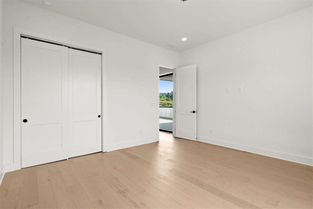 326 Treble Way Alpharetta, GA 30009 - Photo 40 of 47 a view of an empty room with wooden floor