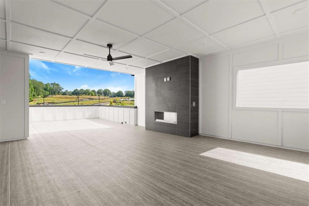 326 Treble Way Alpharetta, GA 30009 - Photo 42 of 47 an empty room with wooden floor and windows