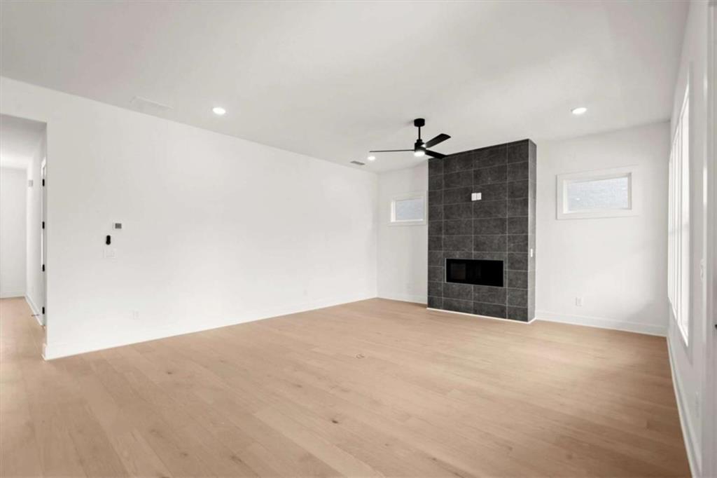 326 Treble Way Alpharetta, GA 30009 - Photo 5 of 47 a view of an empty room with a fireplace and a window
