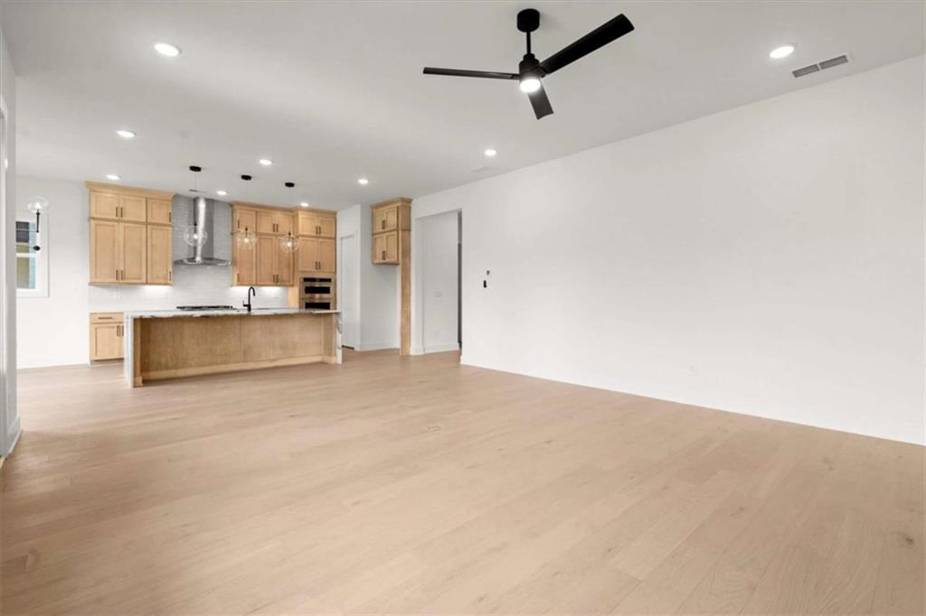 326 Treble Way Alpharetta, GA 30009 - Photo 7 of 47 a living room with stainless steel appliances kitchen island furniture and a view of kitchen