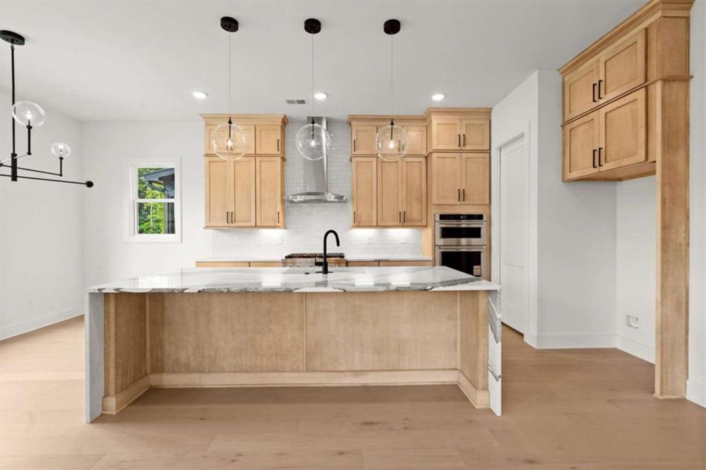 326 Treble Way Alpharetta, GA 30009 - Photo 8 of 47 a view of kitchen with stainless steel appliances granite countertop a sink and dishwasher with white cabinets