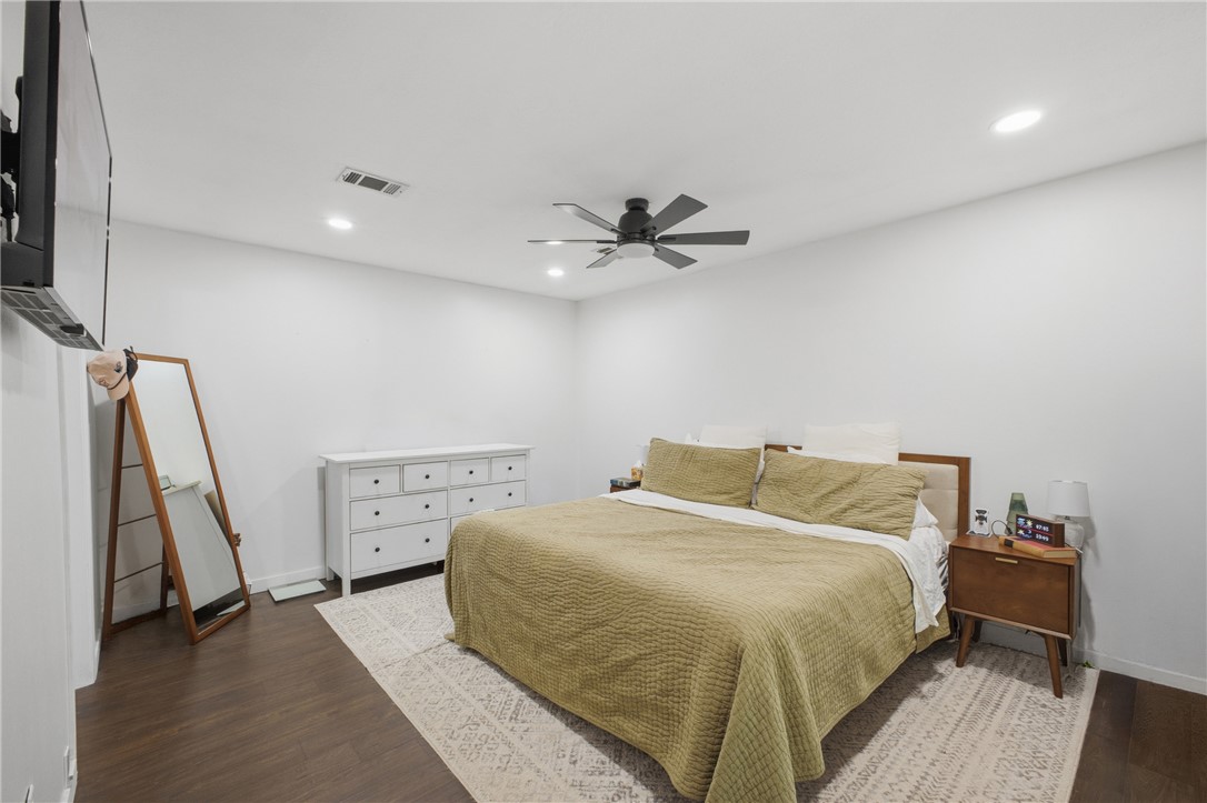 2012 Red River Drive Bryan, TX 77802 - Photo 15 of 23 a bedroom with a bed and a ceiling fan