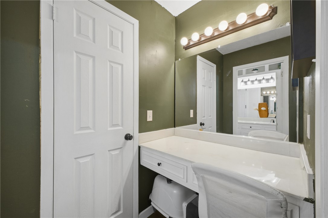 2012 Red River Drive Bryan, TX 77802 - Photo 16 of 23 a bathroom with a sink vanity and a mirror