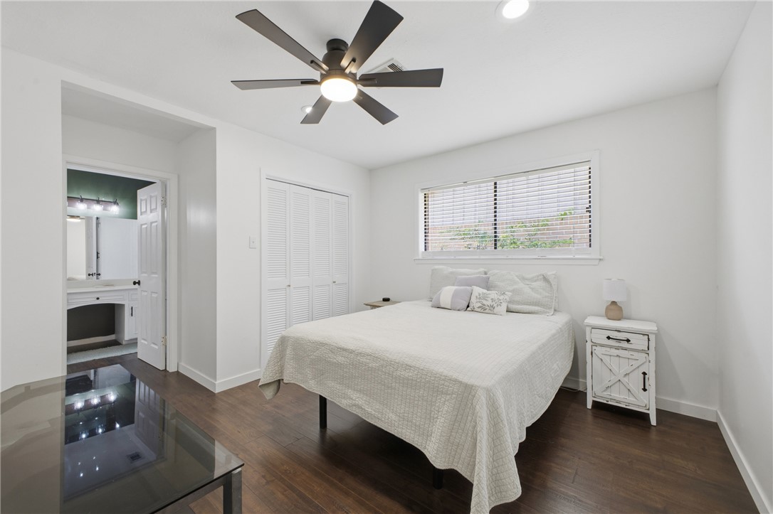 2012 Red River Drive Bryan, TX 77802 - Photo 18 of 23 a bedroom with a bed and a chandelier