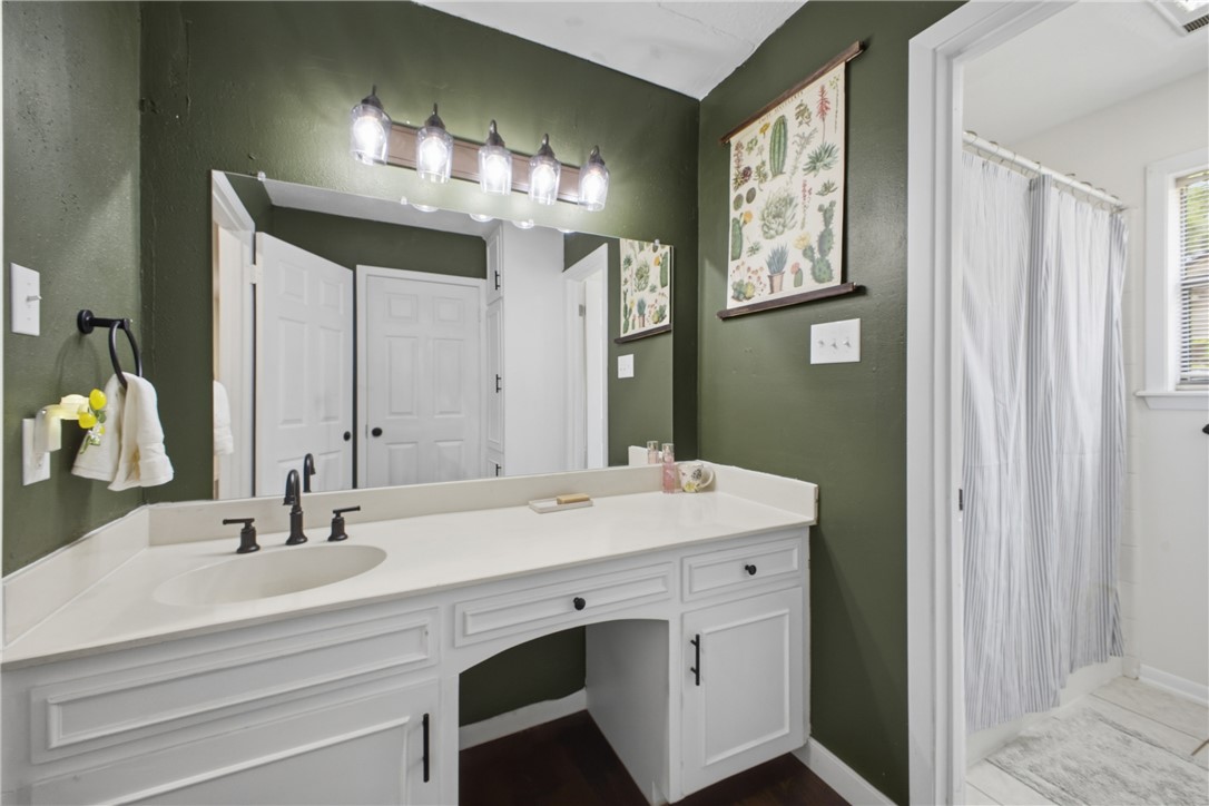 2012 Red River Drive Bryan, TX 77802 - Photo 19 of 23 a bathroom with a sink double vanity and a mirror