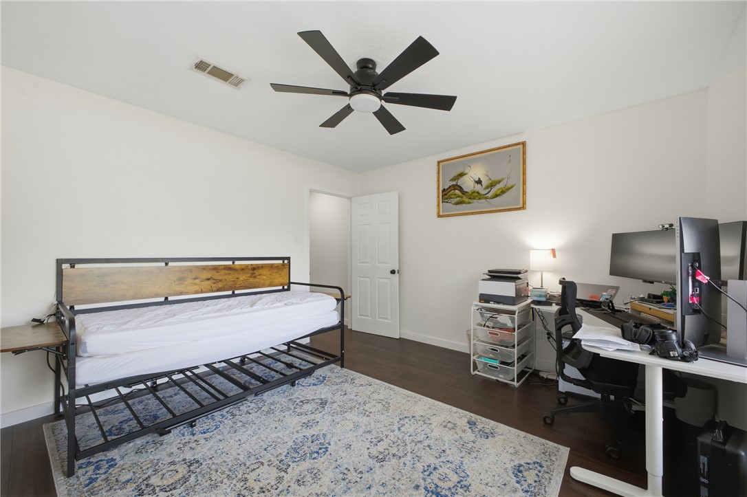2012 Red River Drive Bryan, TX 77802 - Photo 20 of 23 a bedroom with a bed and a desk