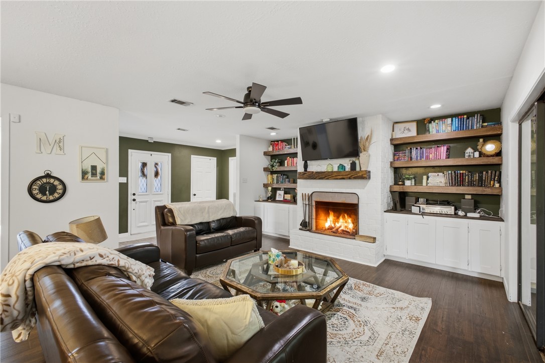 2012 Red River Drive Bryan, TX 77802 - Photo 5 of 23 a living room with furniture and a fireplace