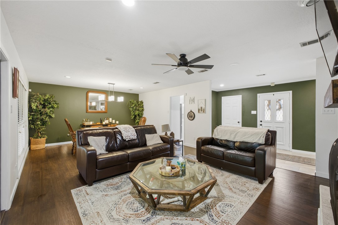 2012 Red River Drive Bryan, TX 77802 - Photo 8 of 23 a living room with furniture and a wooden floor