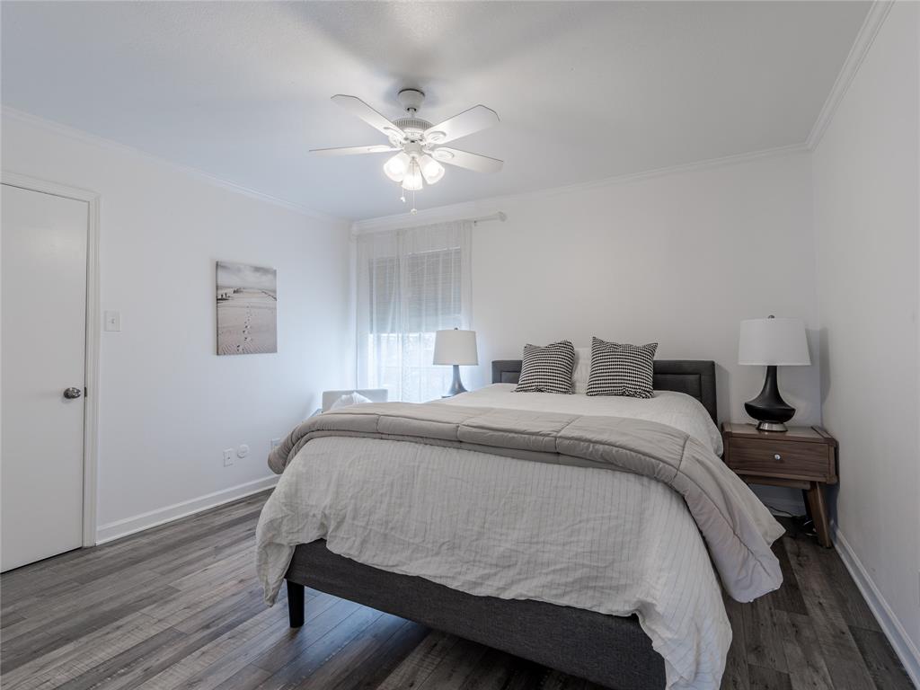 4748 Old Bent Tree Lane, Unit 201 Dallas, TX 75287 - Photo 5 of 17 Bedroom featuring ornamental molding, wood finished floors, and ceiling fan