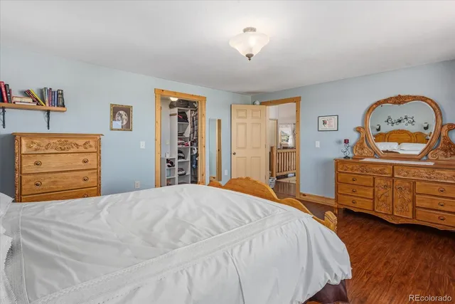 a bathroom with a granite countertop sink and a bathtub