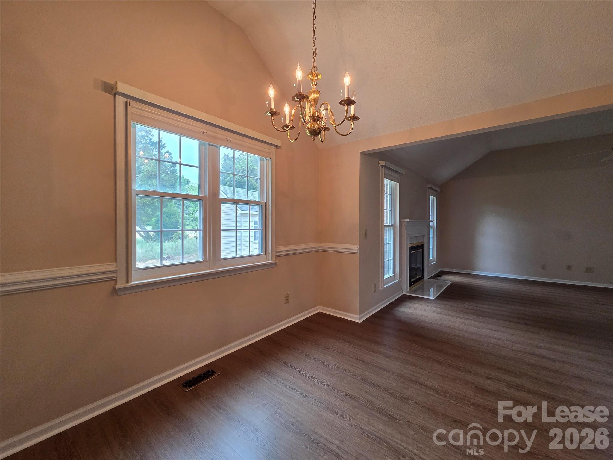 1319 Mistletoe Ridge Place Northwest Concord, NC 28027 - Photo 11 of 35 a view of an empty room with wooden floor and a window