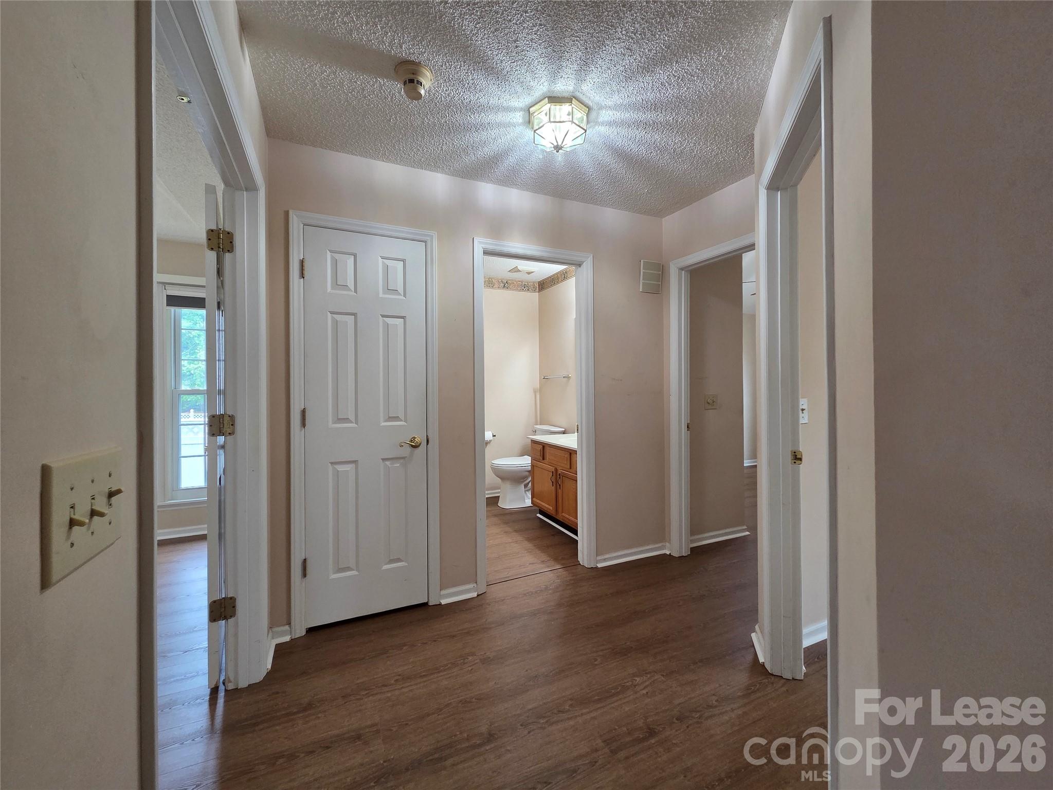 1319 Mistletoe Ridge Place Northwest Concord, NC 28027 - Photo 13 of 35 wooden floor in an empty room with a gallery
