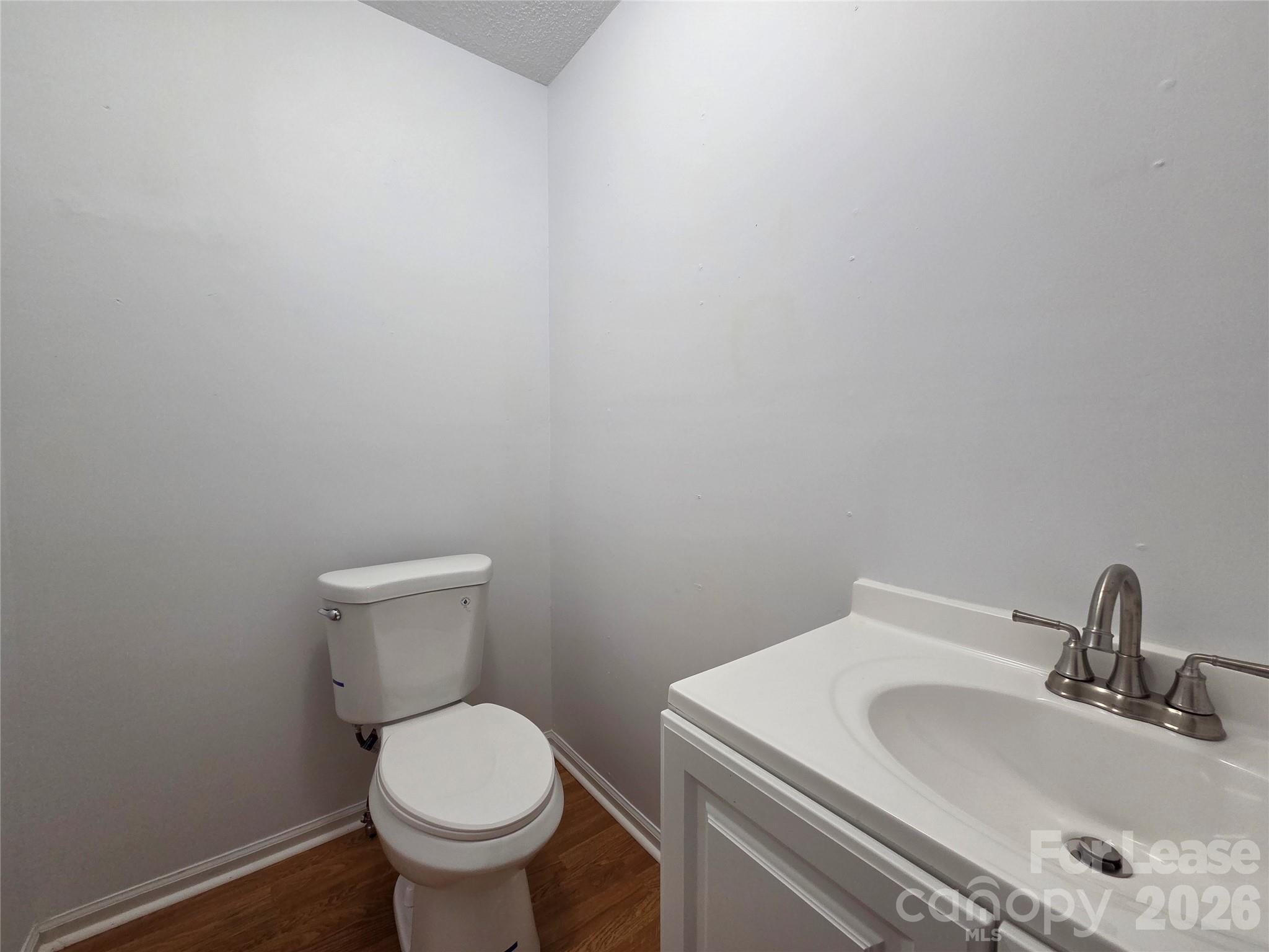 1319 Mistletoe Ridge Place Northwest Concord, NC 28027 - Photo 14 of 35 a bathroom with a sink and a toilet
