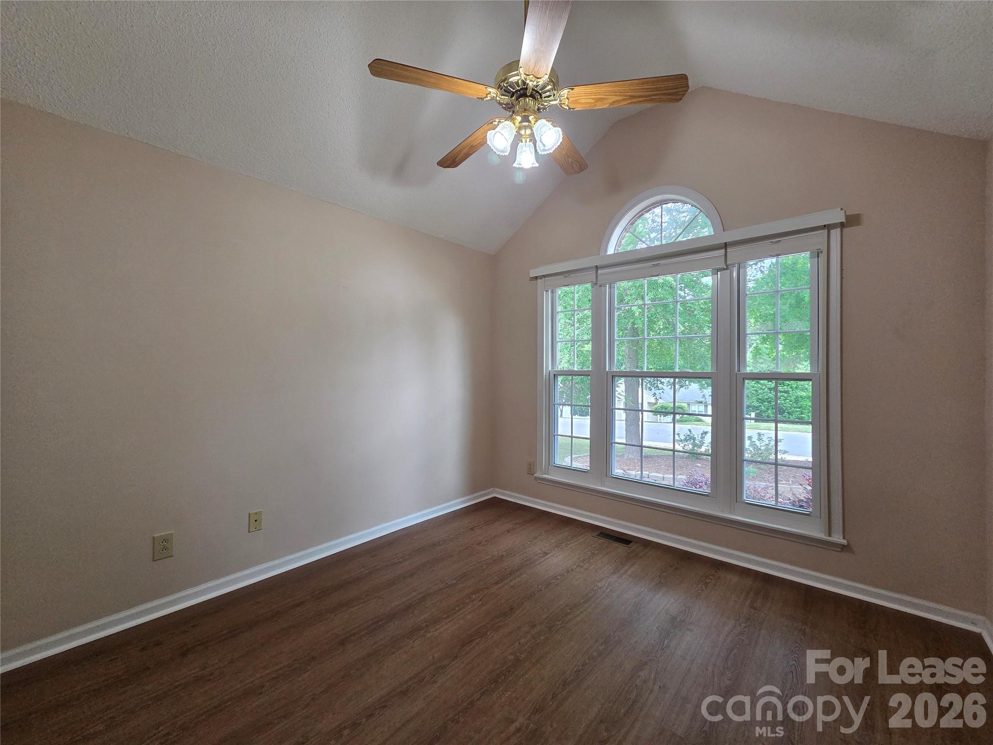 1319 Mistletoe Ridge Place Northwest Concord, NC 28027 - Photo 17 of 35 wooden floor in an empty room with a window