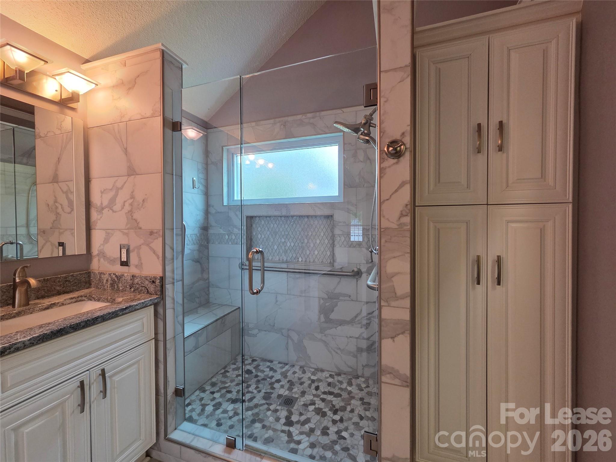 1319 Mistletoe Ridge Place Northwest Concord, NC 28027 - Photo 19 of 35 a bathroom with a shower and a sink