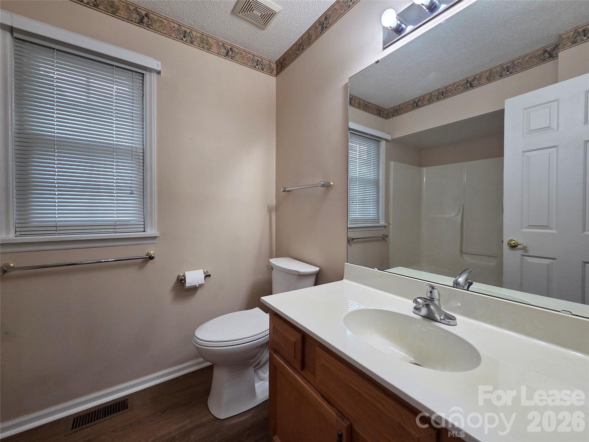 1319 Mistletoe Ridge Place Northwest Concord, NC 28027 - Photo 23 of 35 a bathroom with a sink toilet and a mirror