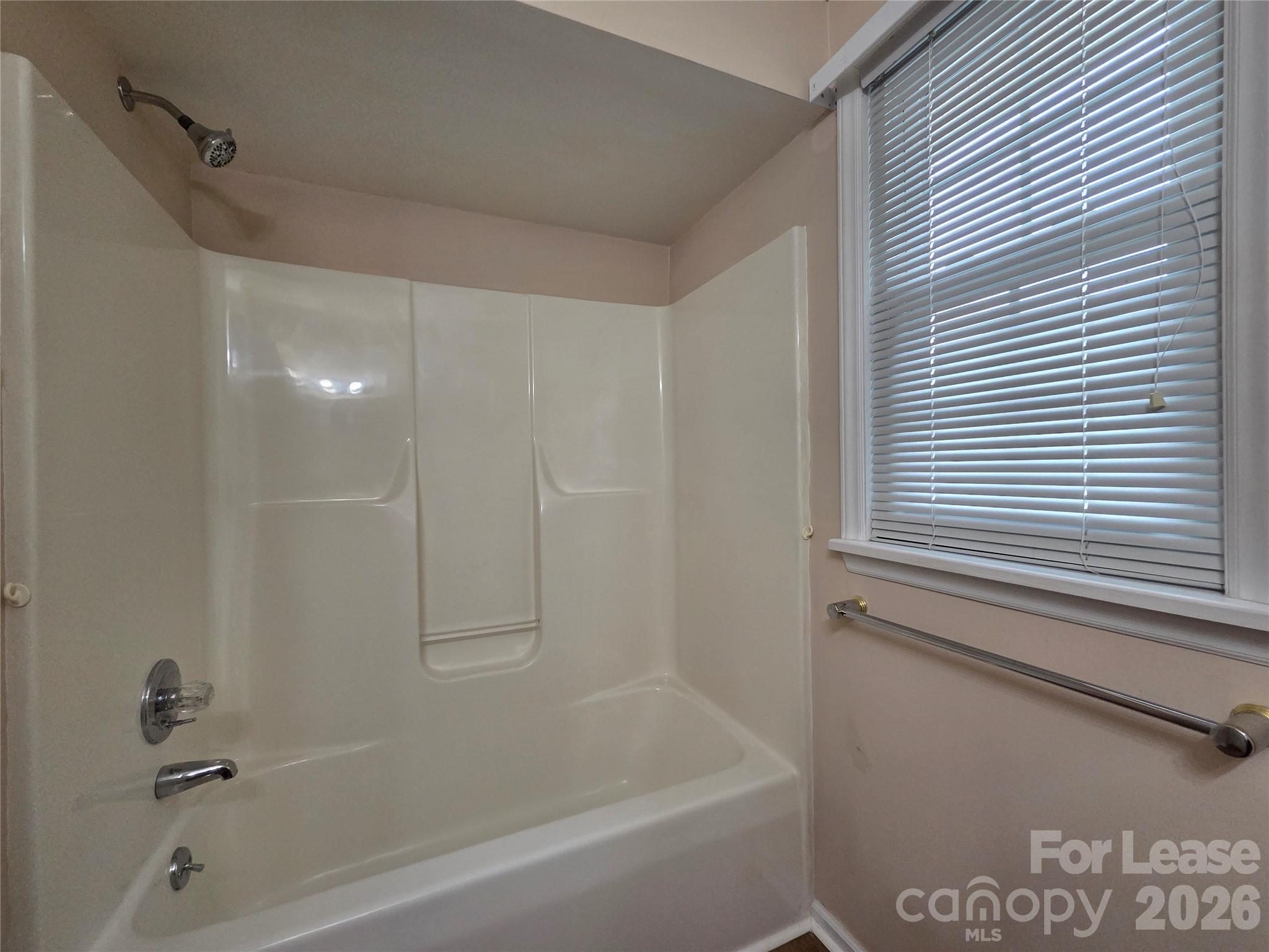 1319 Mistletoe Ridge Place Northwest Concord, NC 28027 - Photo 24 of 35 a bathroom with a bathtub and a shower