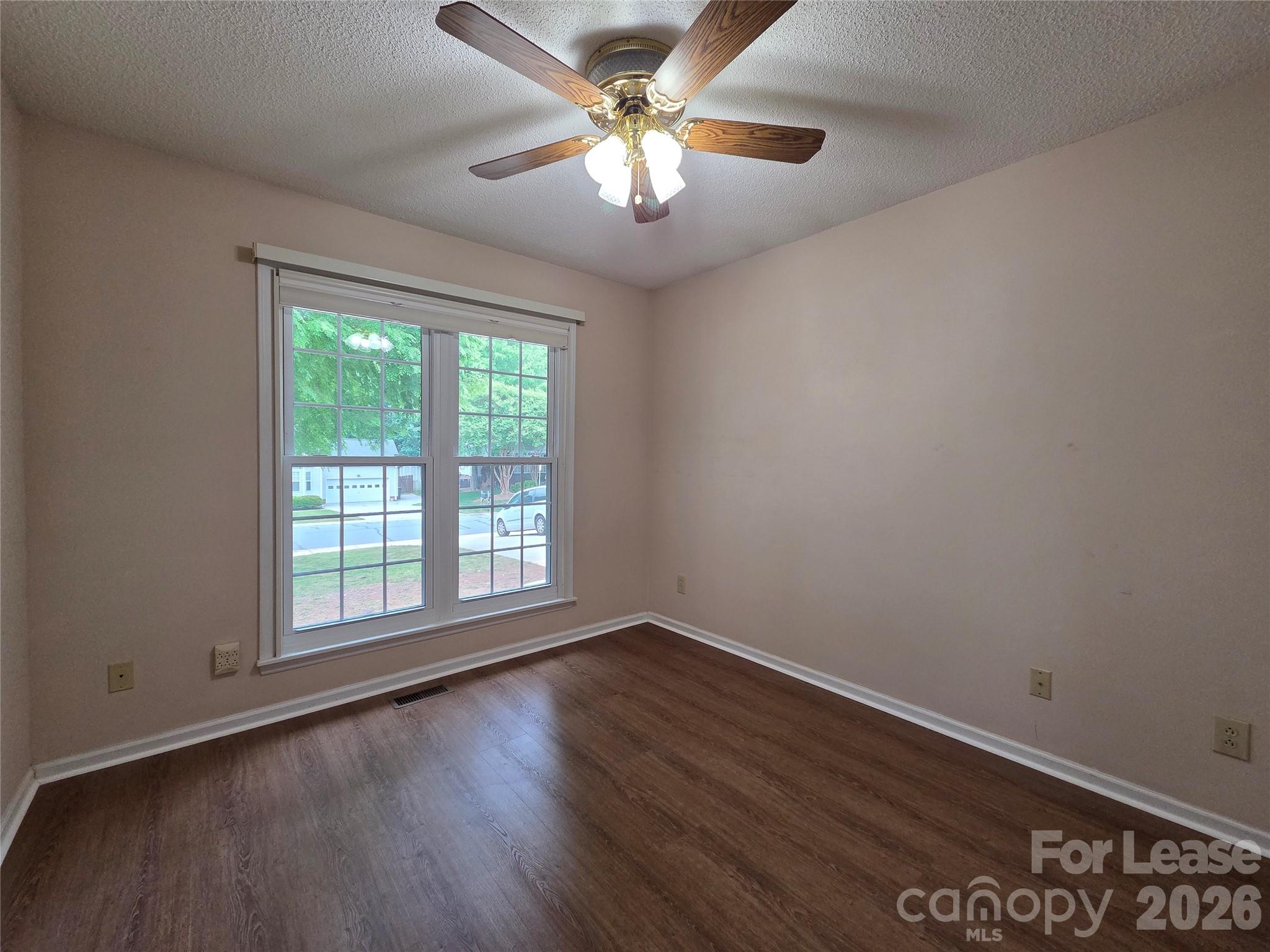 1319 Mistletoe Ridge Place Northwest Concord, NC 28027 - Photo 25 of 35 wooden floor in an empty room with a window