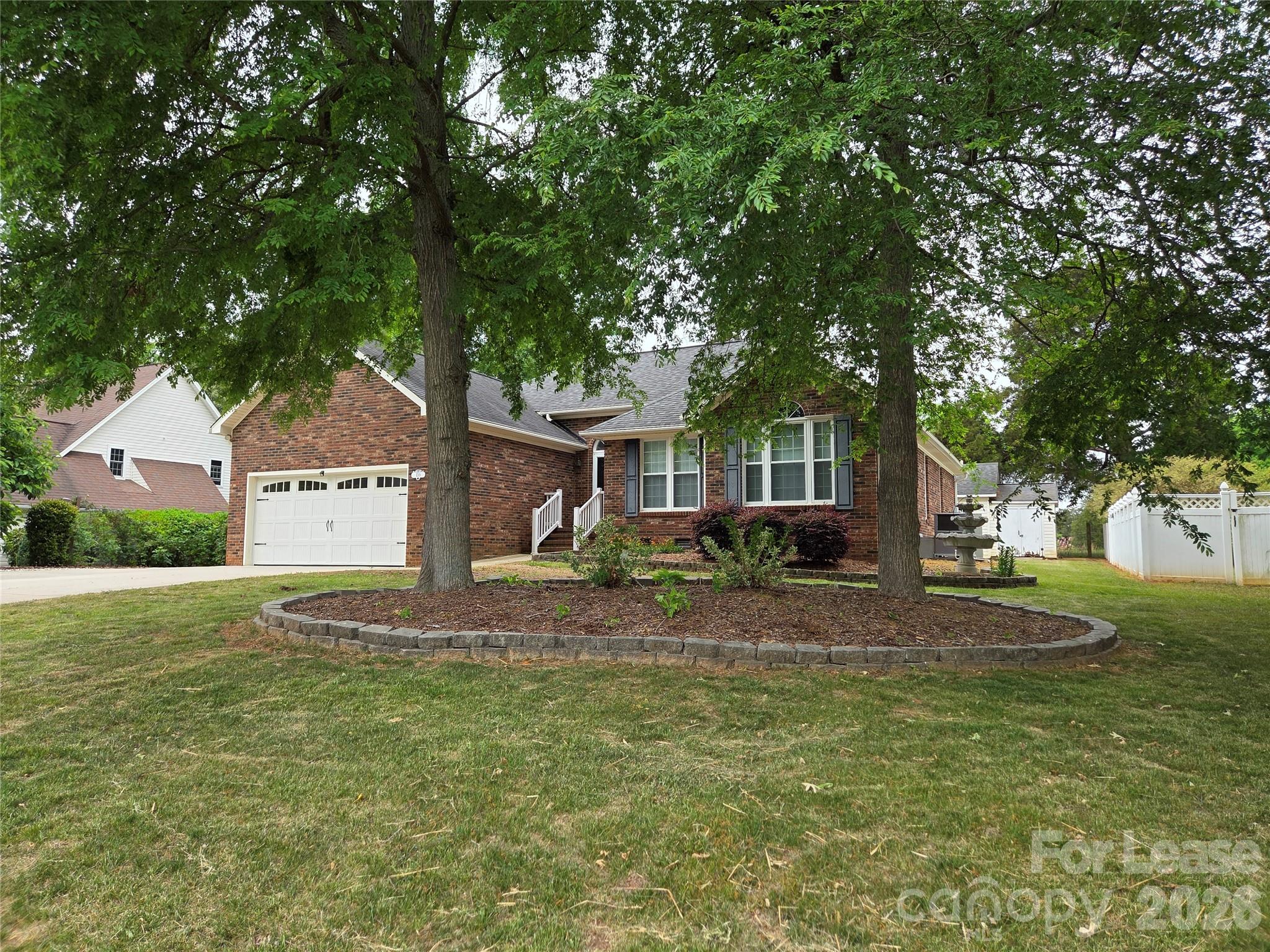 1319 Mistletoe Ridge Place Northwest Concord, NC 28027 - Photo 34 of 35 a front view of a house with garden