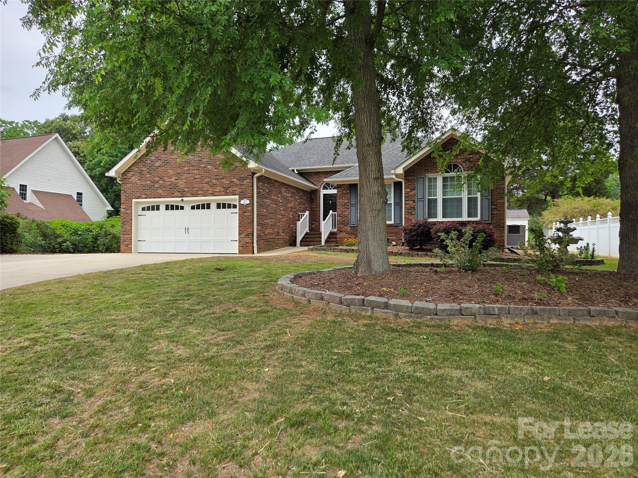 1319 Mistletoe Ridge Place Northwest Concord, NC 28027 - Photo 35 of 35 a front view of a house with garden