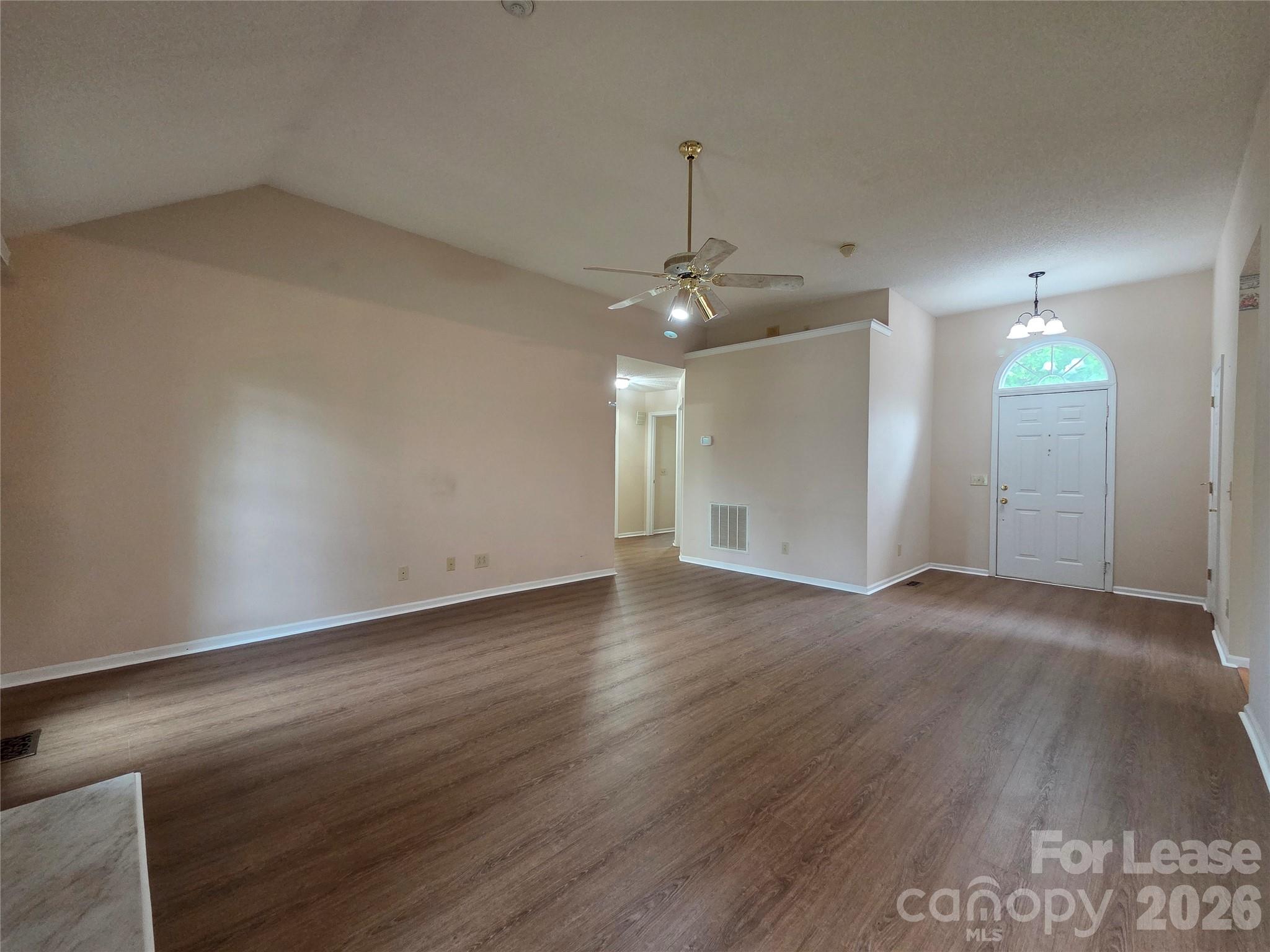1319 Mistletoe Ridge Place Northwest Concord, NC 28027 - Photo 5 of 35 an empty room with wooden floor and windows