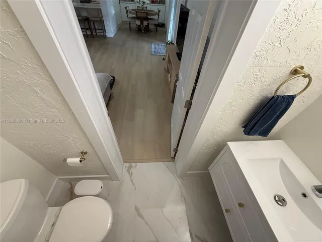 a bathroom with a toilet and a tub