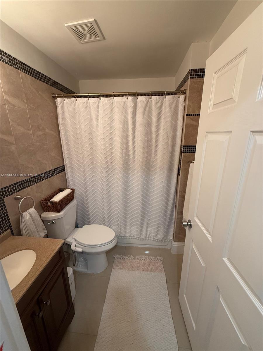 20912 Southwest 125th Avenue Road Miami, FL 33177 - Photo 12 of 25 a bathroom with a sink and a toilet