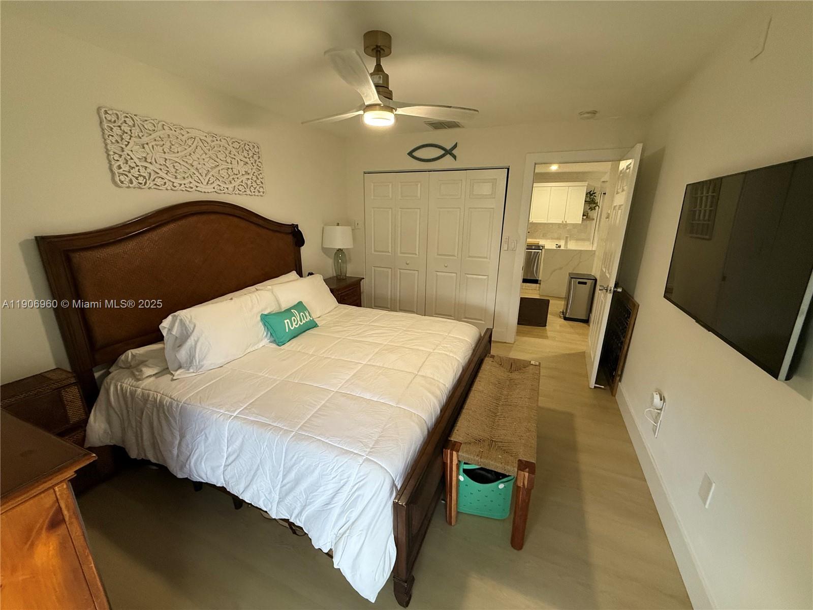 20912 Southwest 125th Avenue Road Miami, FL 33177 - Photo 14 of 25 a bedroom with a bed and mirror on the dresser