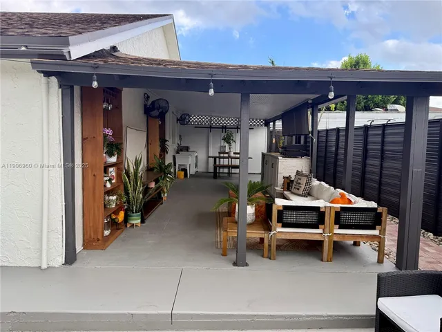 a view of a chairs and tables in a patio