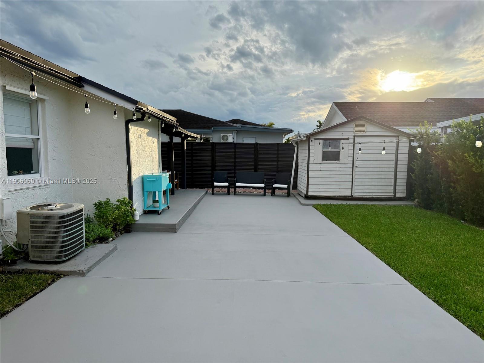 20912 Southwest 125th Avenue Road Miami, FL 33177 - Photo 22 of 25 a view of a house with a yard and sitting area