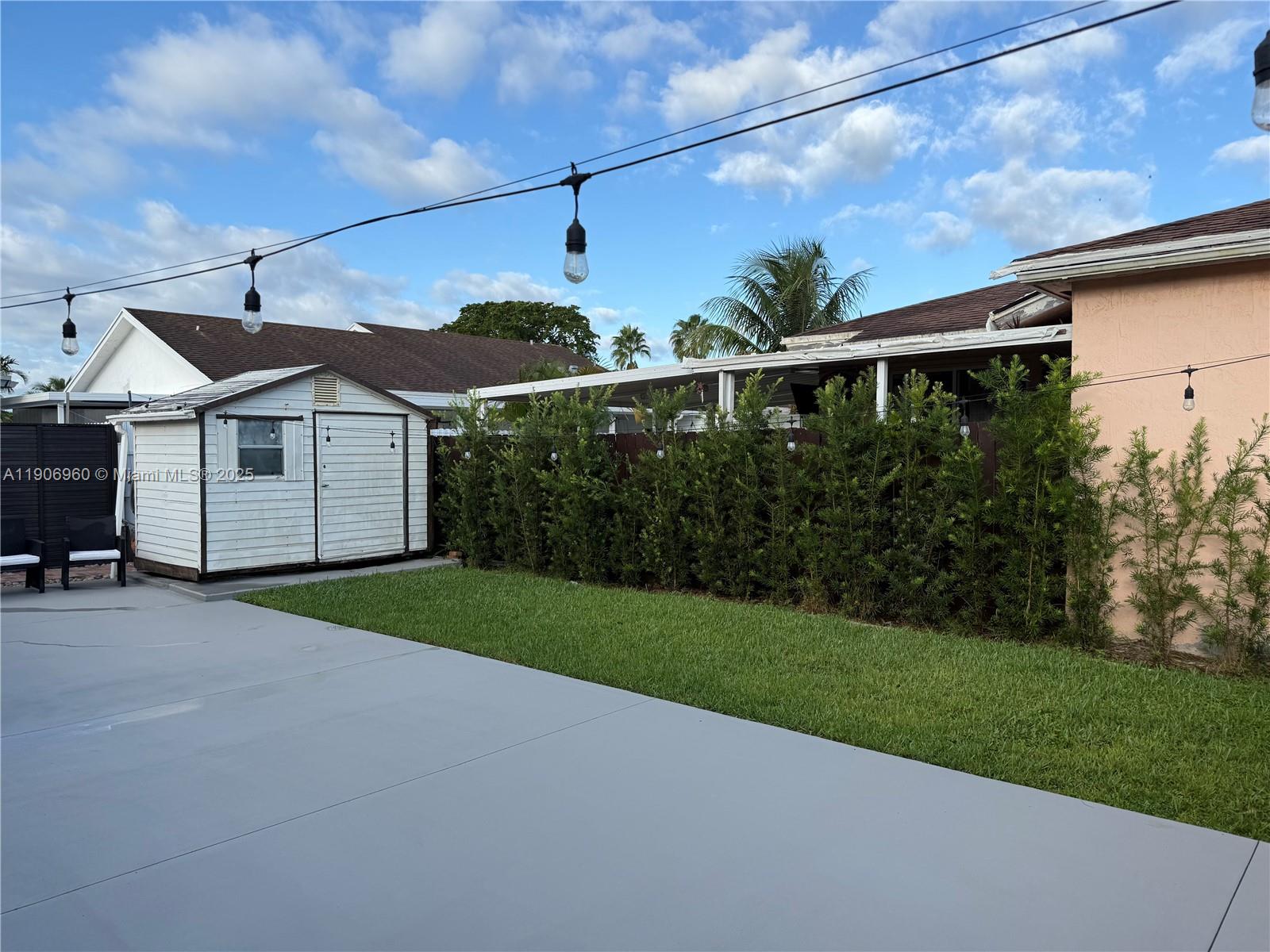 20912 Southwest 125th Avenue Road Miami, FL 33177 - Photo 24 of 25 a front view of a house with garden
