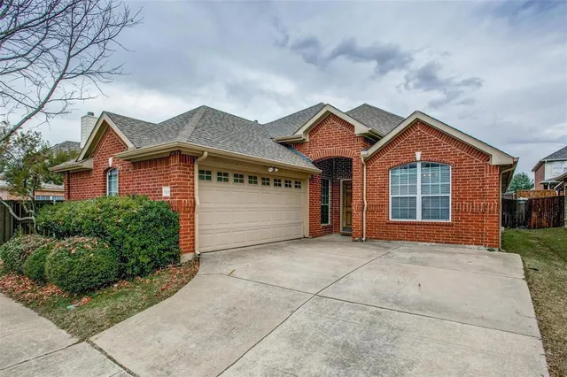 a front view of a house with a garage