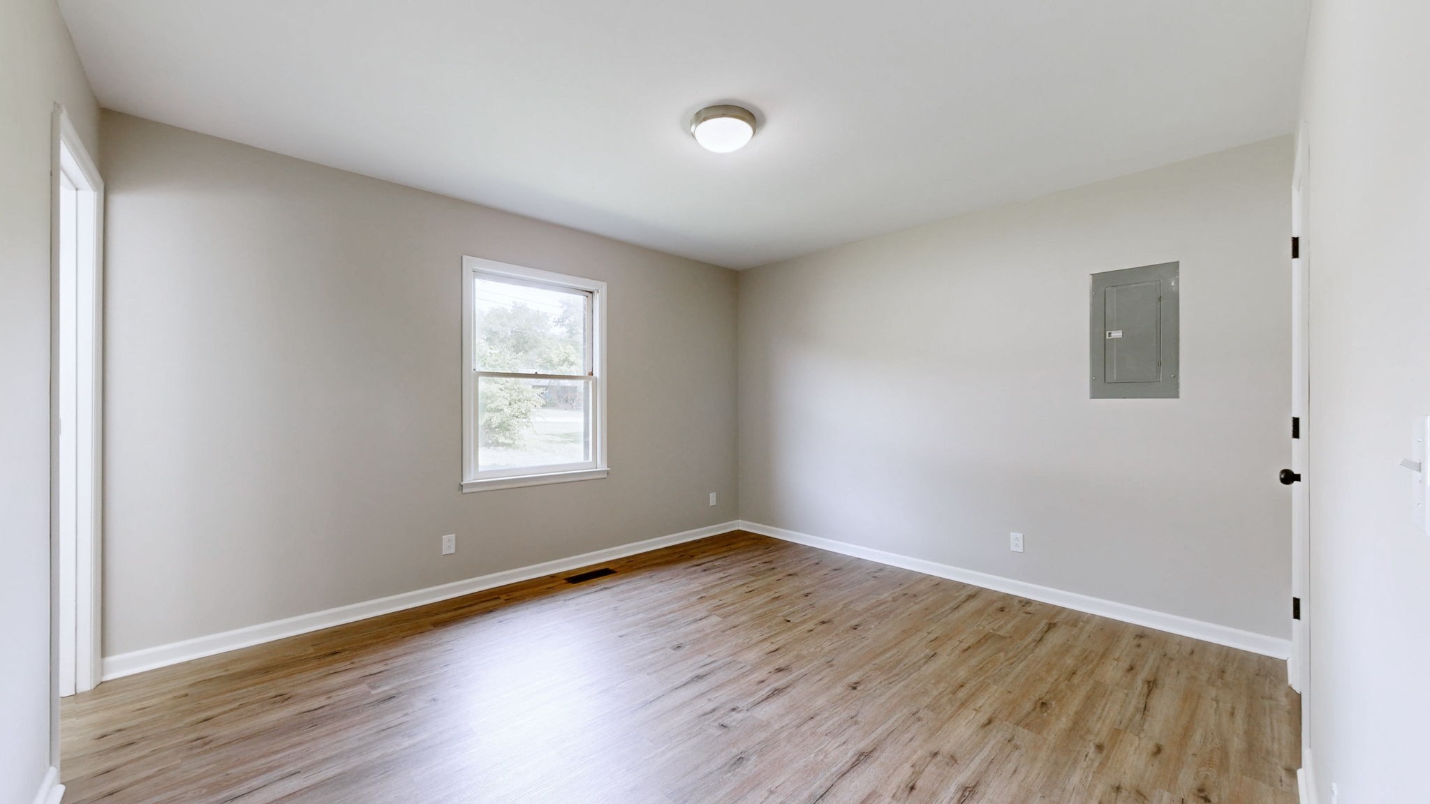 3460 Bradyville Road Readyville, TN 37149 - Photo 15 of 42 an empty room with wooden floor and windows