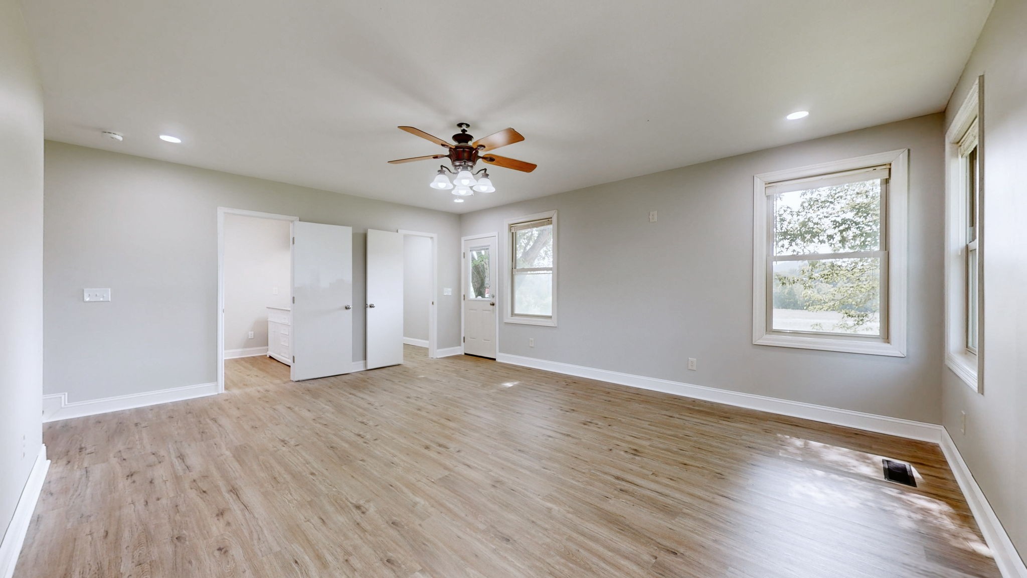 3460 Bradyville Road Readyville, TN 37149 - Photo 18 of 42 a view of an empty room with a window and wooden floor