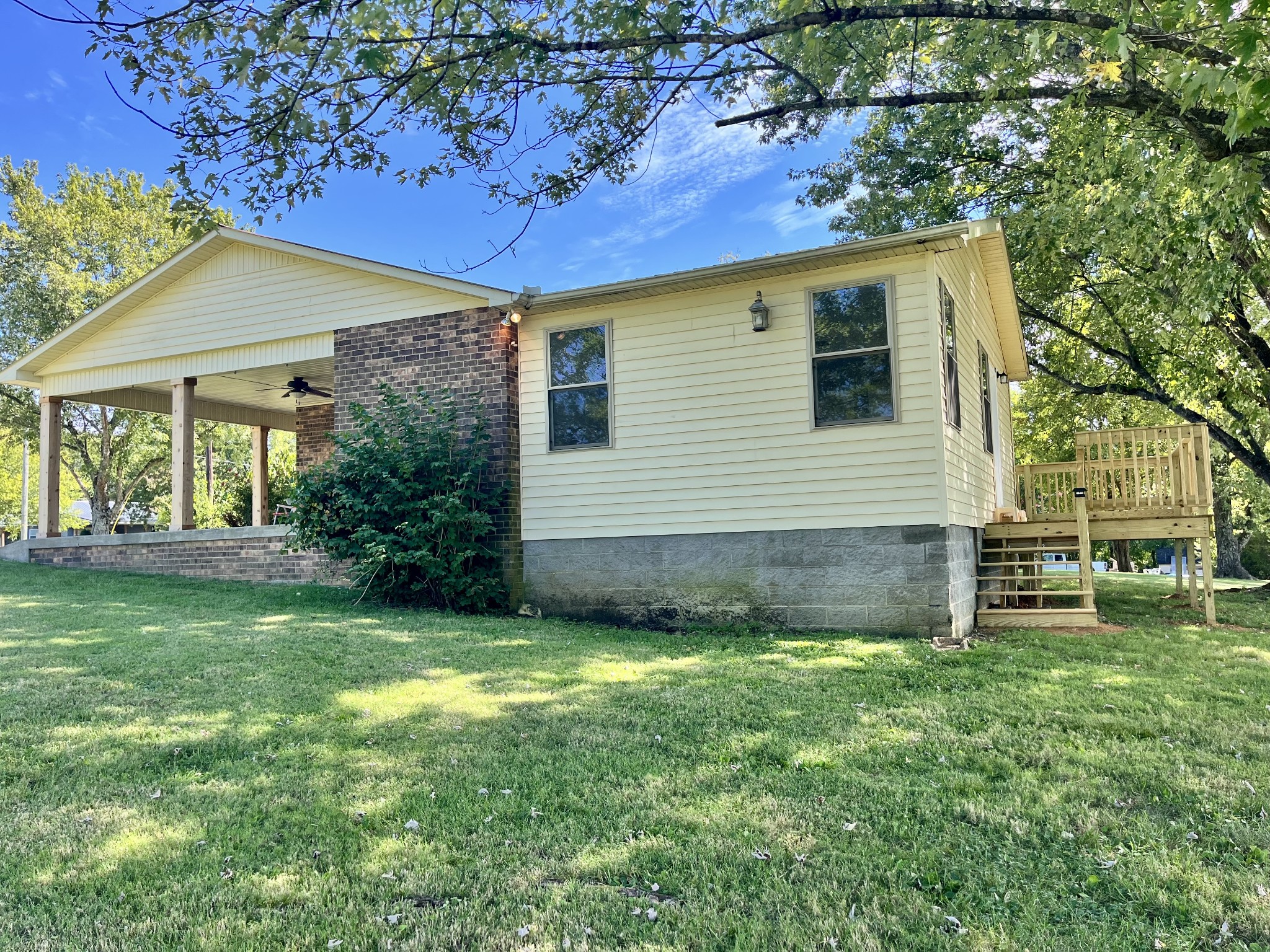 3460 Bradyville Road Readyville, TN 37149 - Photo 41 of 42 a view of a backyard with plants and large tree