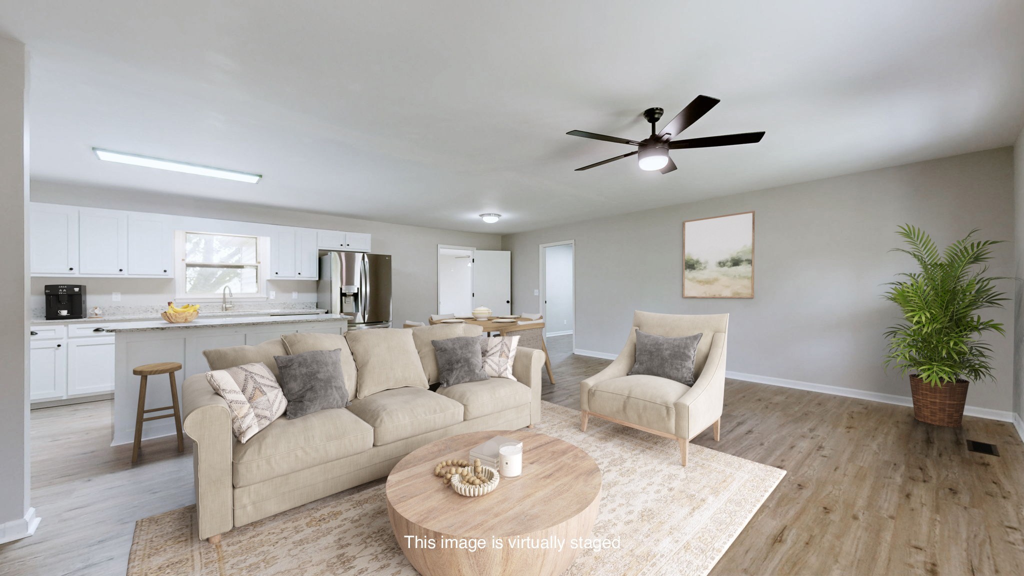 3460 Bradyville Road Readyville, TN 37149 - Photo 5 of 42 a living room with furniture white walls and a potted plant