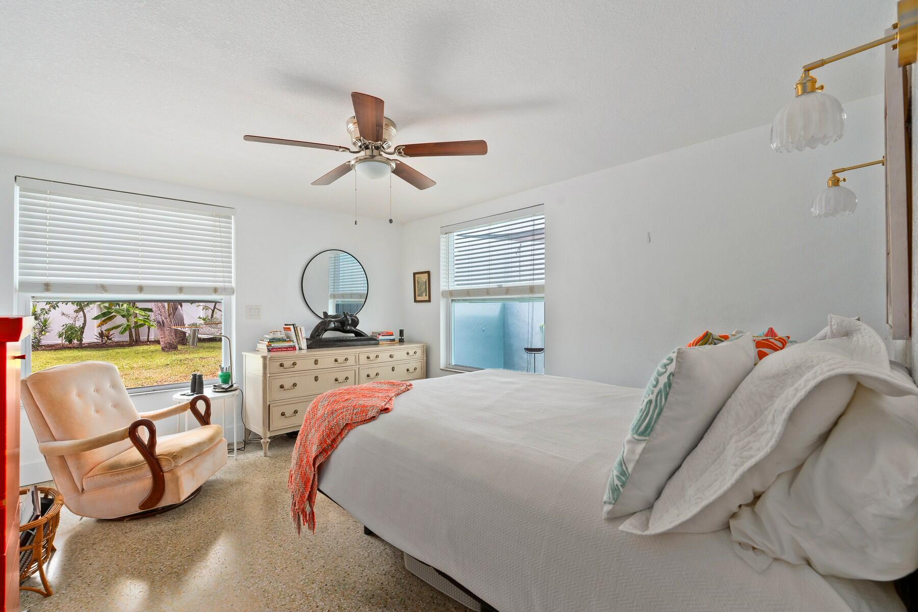 609 South 9th Street Fort Pierce, FL 34950 - Photo 14 of 39 a bedroom with a bed and ceiling fan