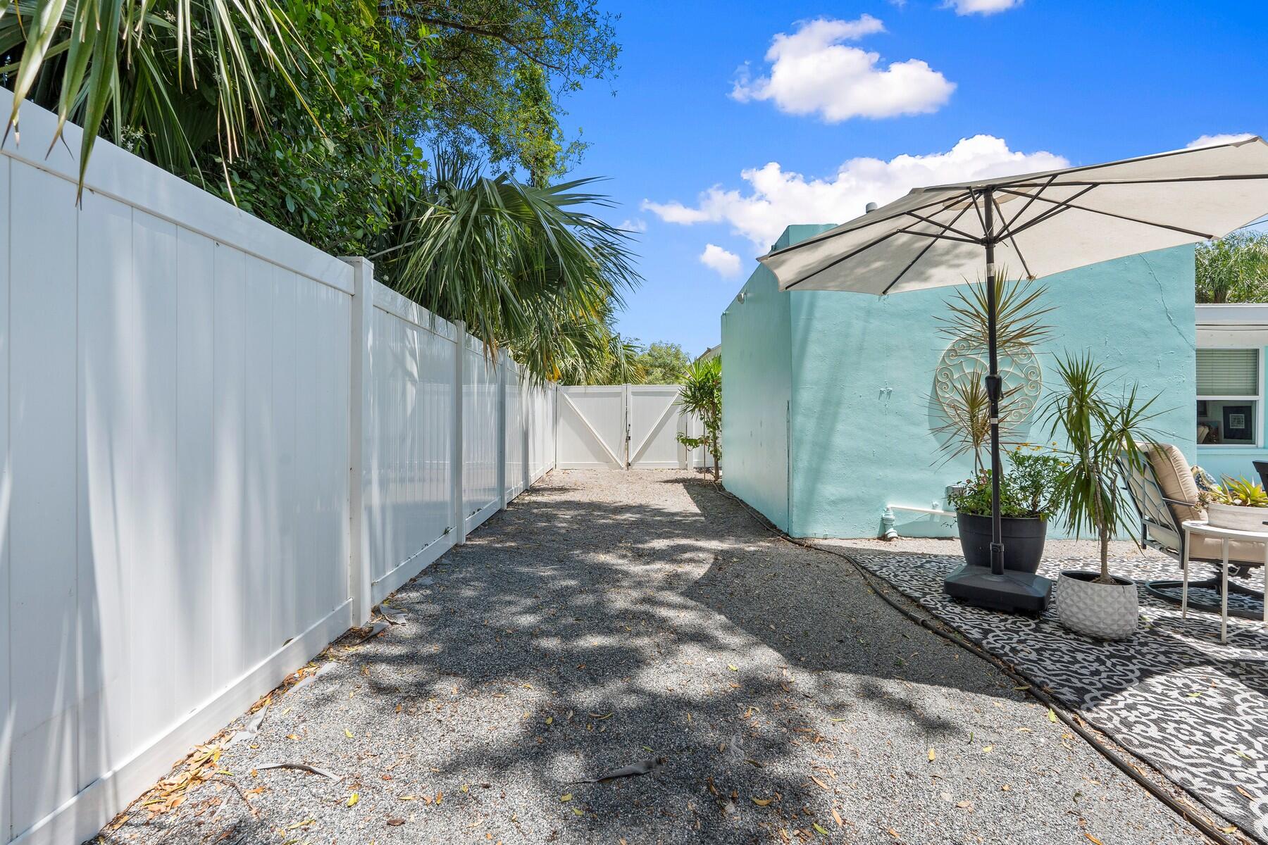 609 South 9th Street Fort Pierce, FL 34950 - Photo 28 of 39 a view of a backyard with potted plants