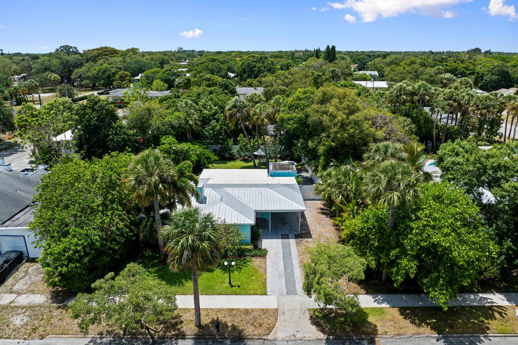 609 South 9th Street Fort Pierce, FL 34950 - Photo 30 of 39 an aerial view of a house with a yard and lake view