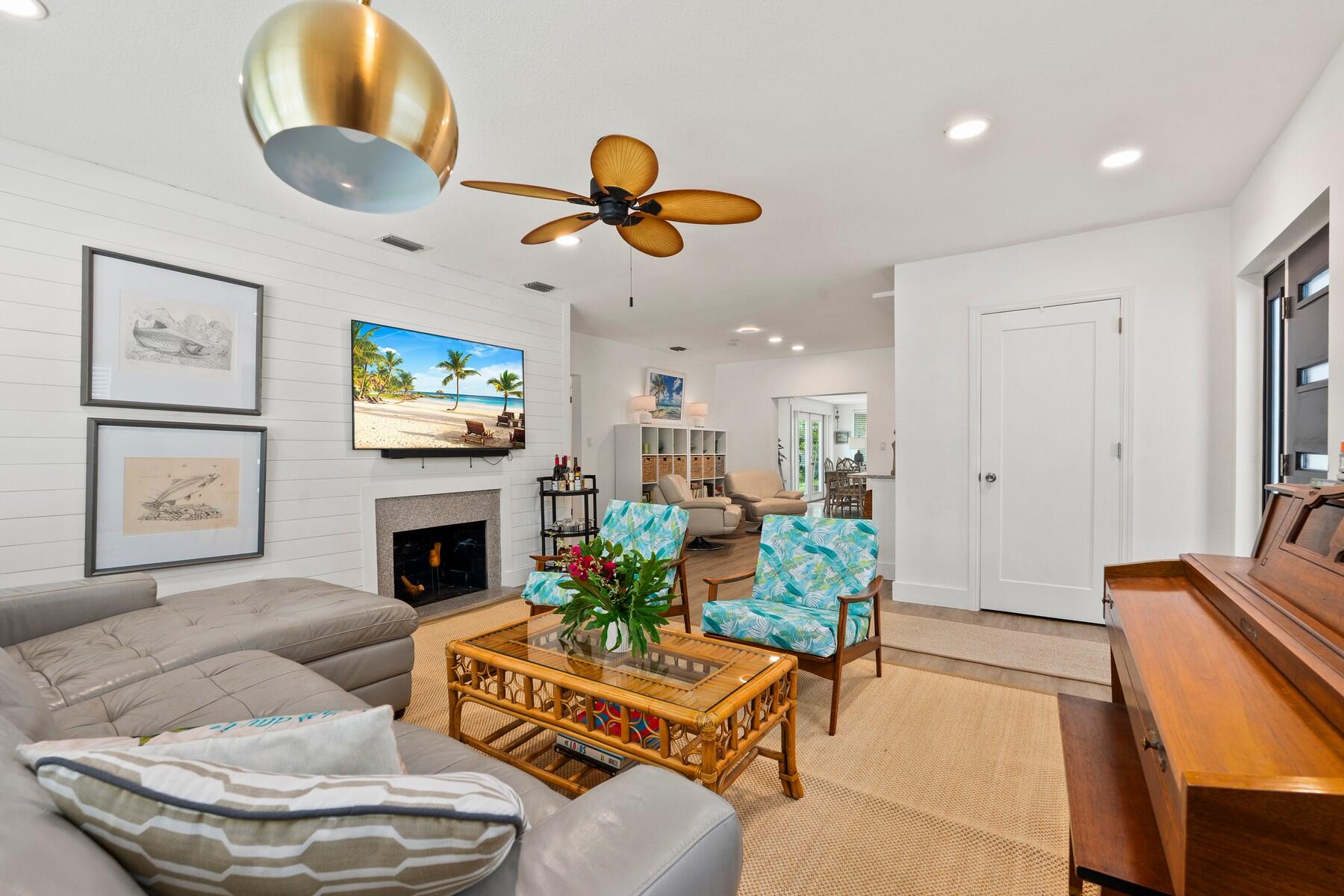 609 South 9th Street Fort Pierce, FL 34950 - Photo 7 of 39 a living room with furniture and a fireplace