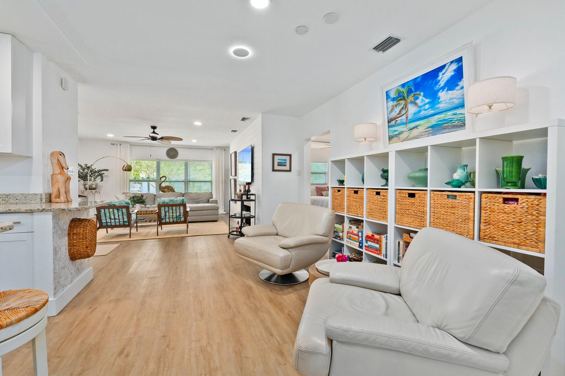 609 South 9th Street Fort Pierce, FL 34950 - Photo 9 of 39 a living room with furniture and a flat screen tv