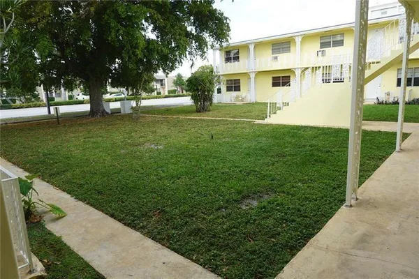 a view of building with yard