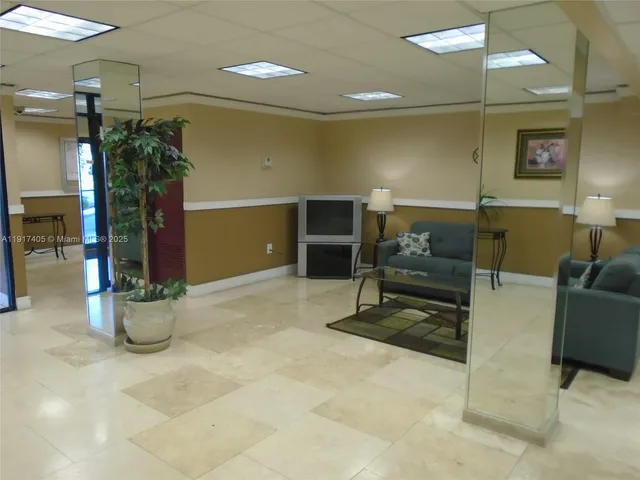 a view of livingroom with furniture and potted plant