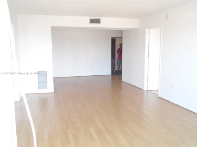 a view of a room with a hallway