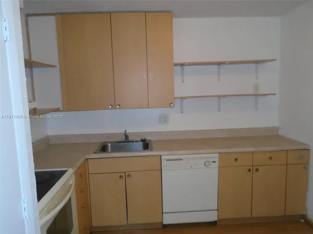 a view of cabinets with wooden floor